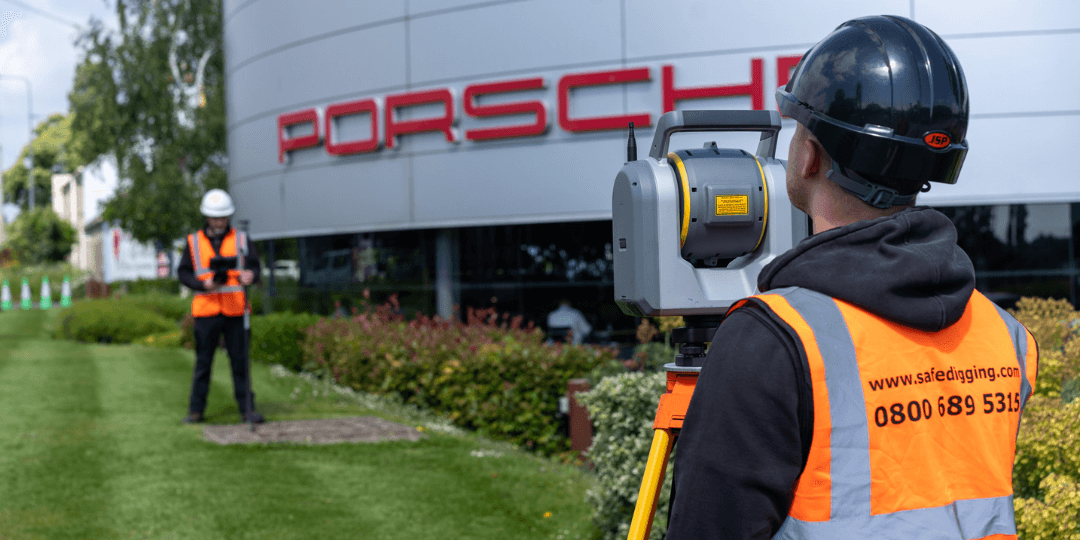 Survey team working outside Porsche building