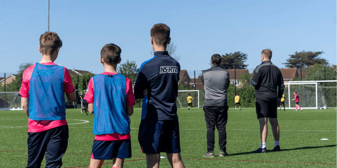 Youth football coaching session on a pitch